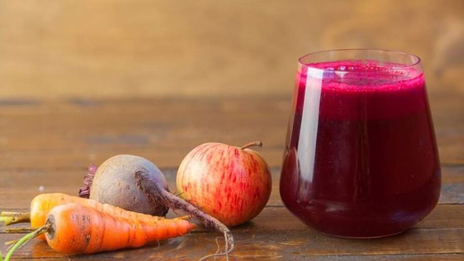 beet juice in glass on table